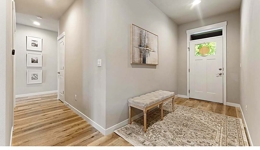 Entry and main living area with laminate flooring