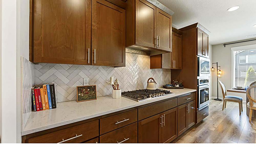 Kitchen with quartz counters, gas range and pantry