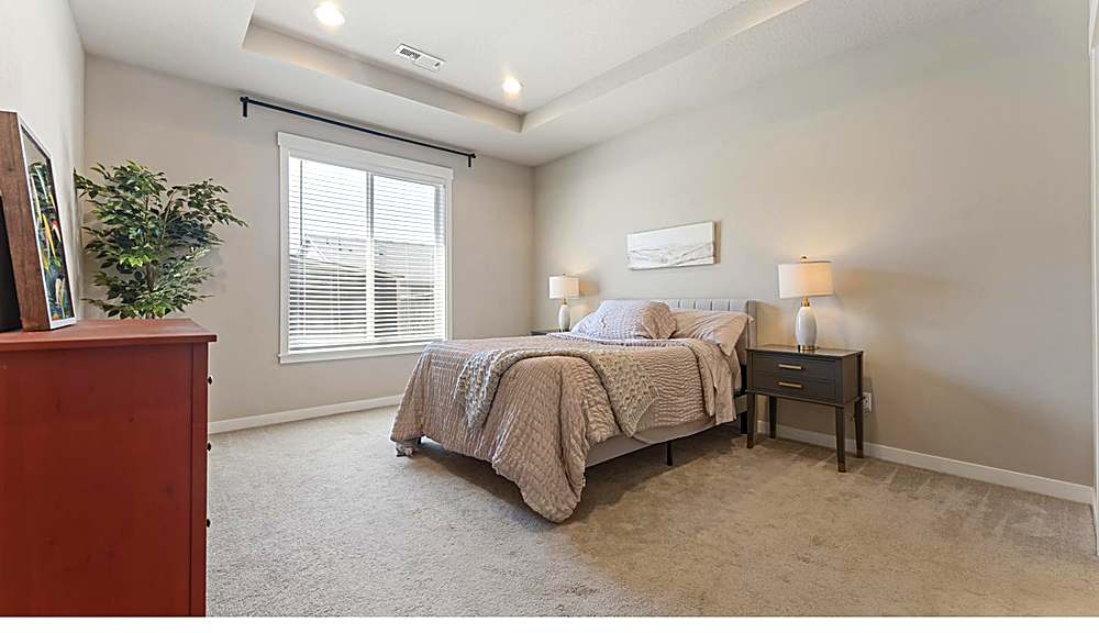Primary suite with natural light and walk-in closet