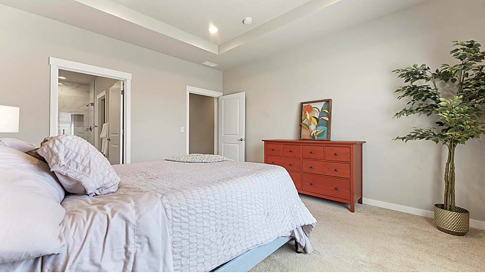 Primary suite with natural light and walk-in closet