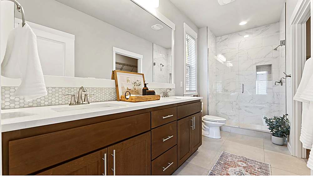 Primary suite with natural light and walk-in closet