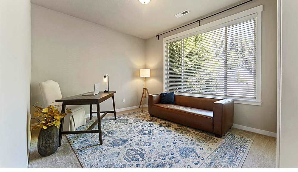 Main-level bedroom, flexible for guests or office