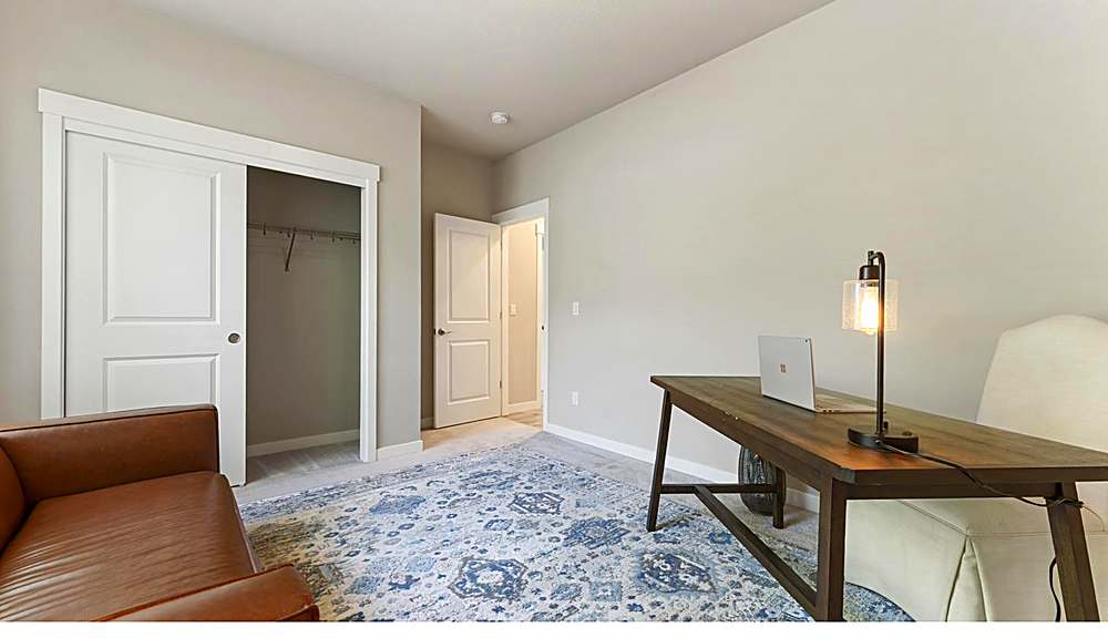 Main-level bedroom, flexible for guests or office