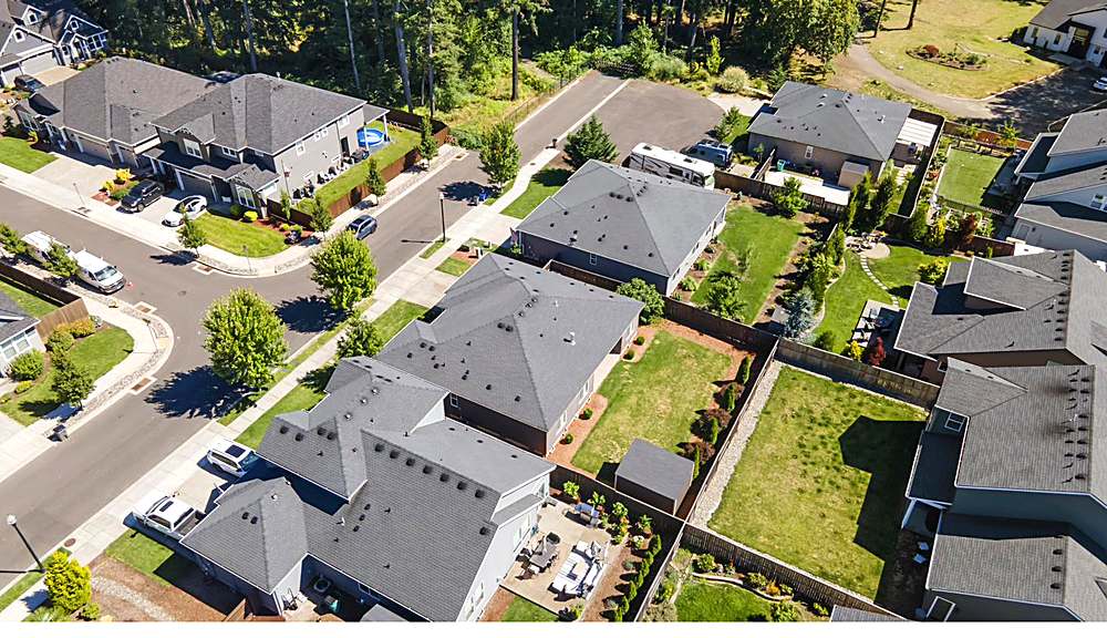 Aerial view of the home and the Orchards neighborhood