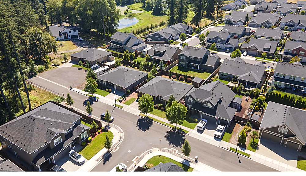 Aerial view of the home and the Orchards neighborhood