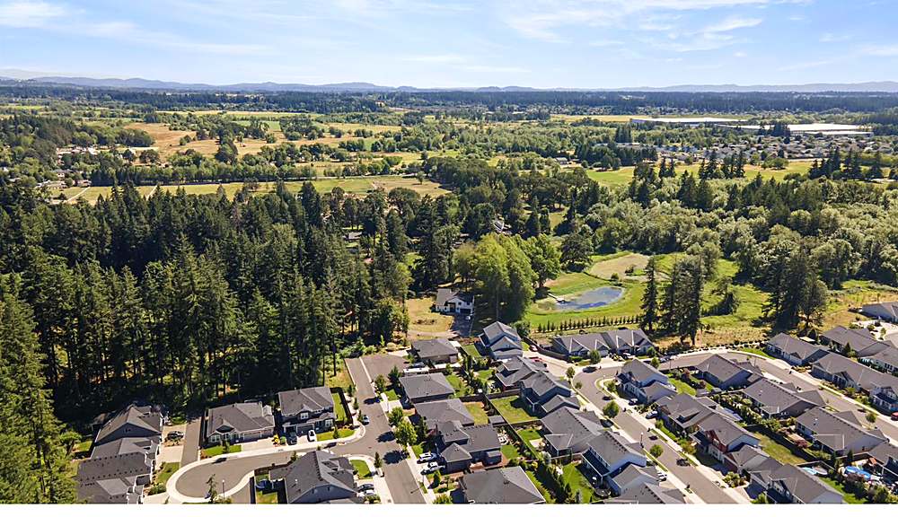 Aerial view of the home and the Orchards neighborhood