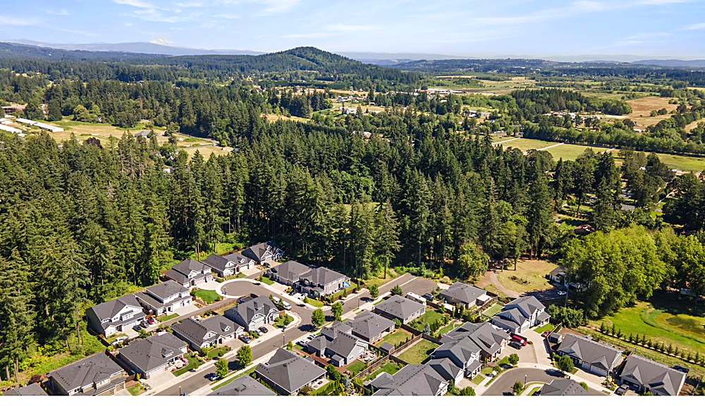 Aerial view of the home and the Orchards neighborhood