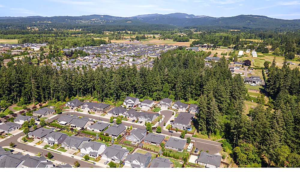 Aerial view of the home and the Orchards neighborhood