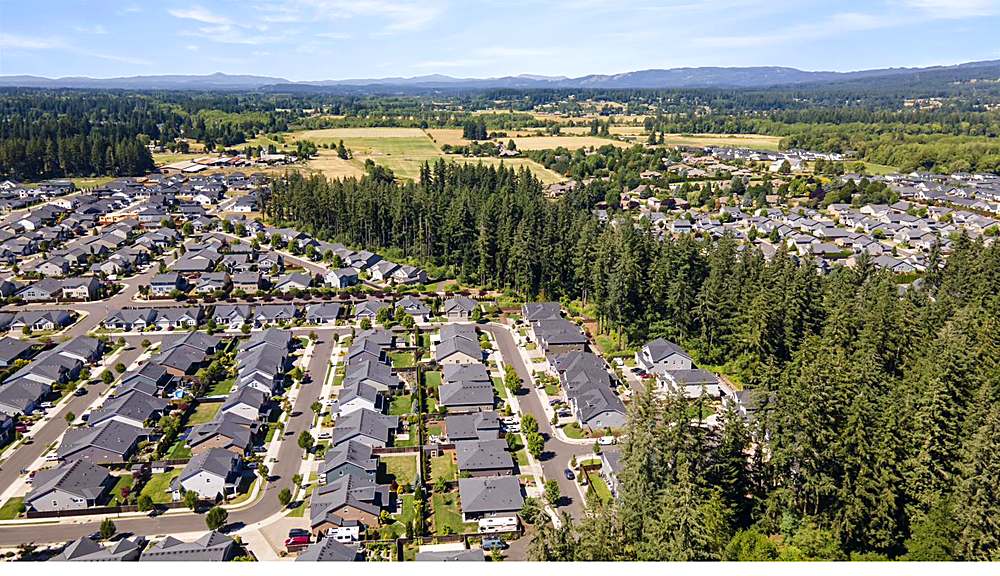 Aerial view of the home and the Orchards neighborhood