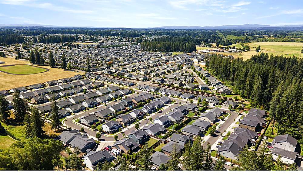 Aerial view of the home and the Orchards neighborhood